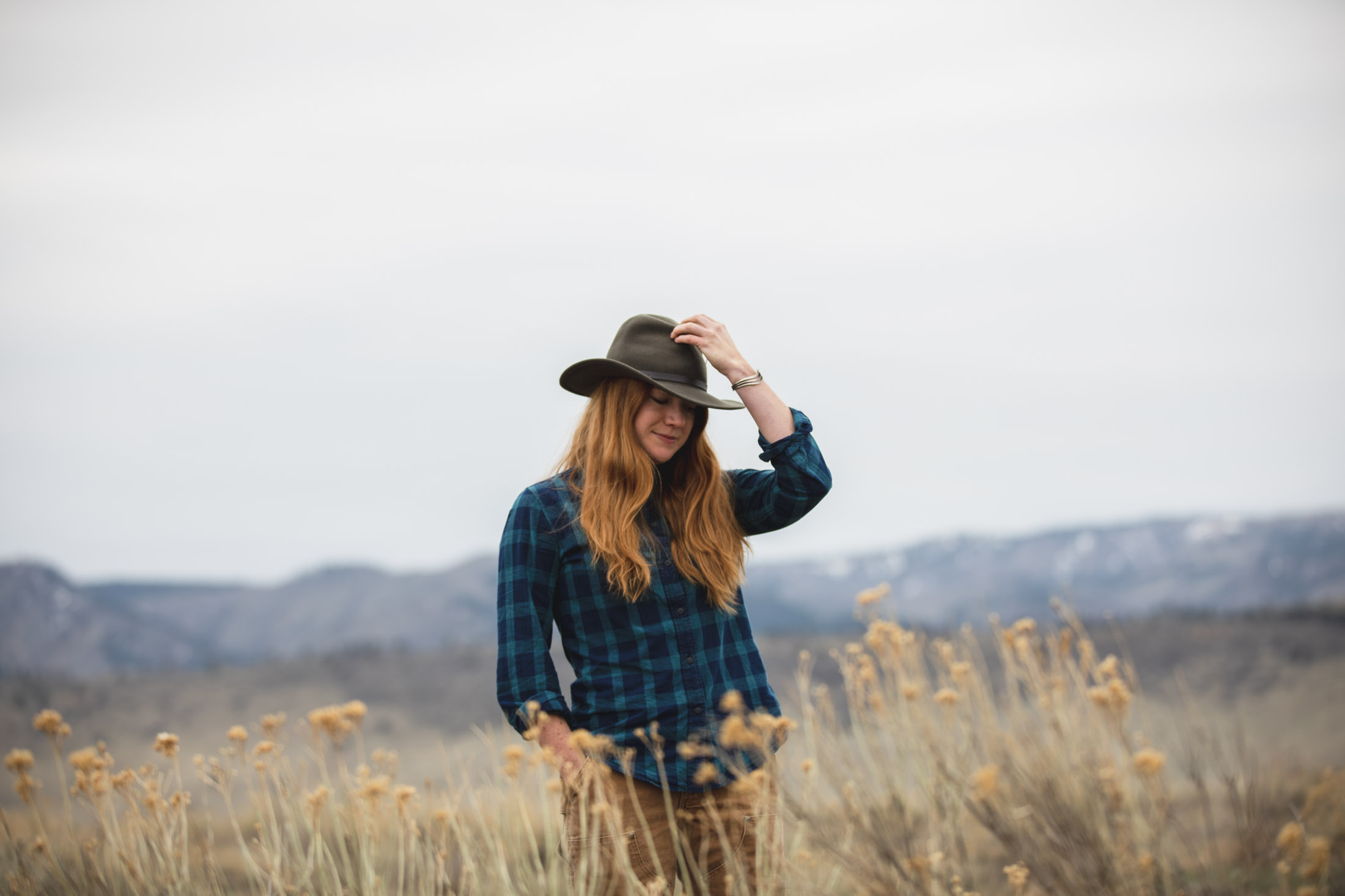 Portrait of a female outdoors writer standing in a field in Fort Collins, Colorado - John Robson Photography