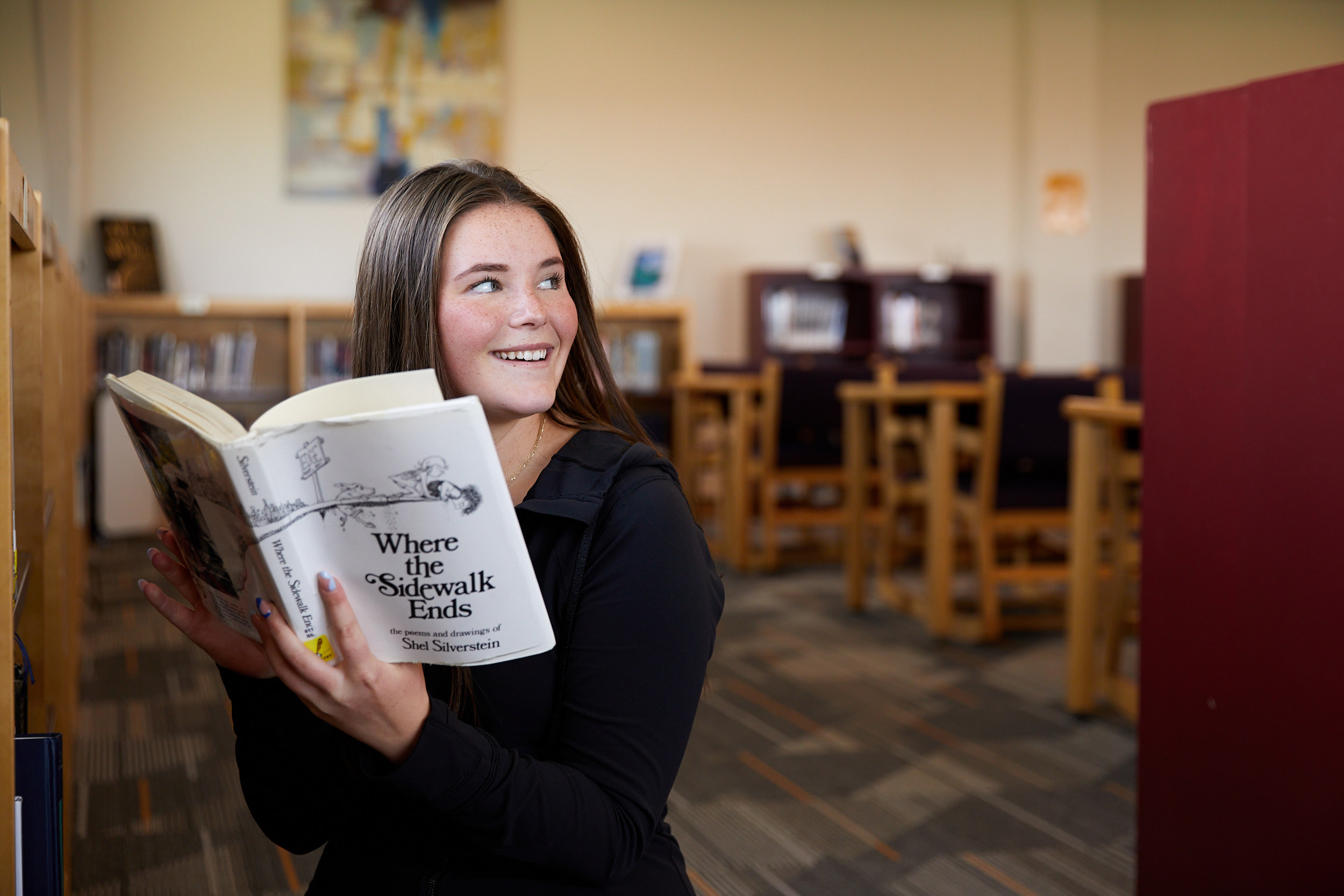 Windsor High School student reading a book in the library - John Robson Photography