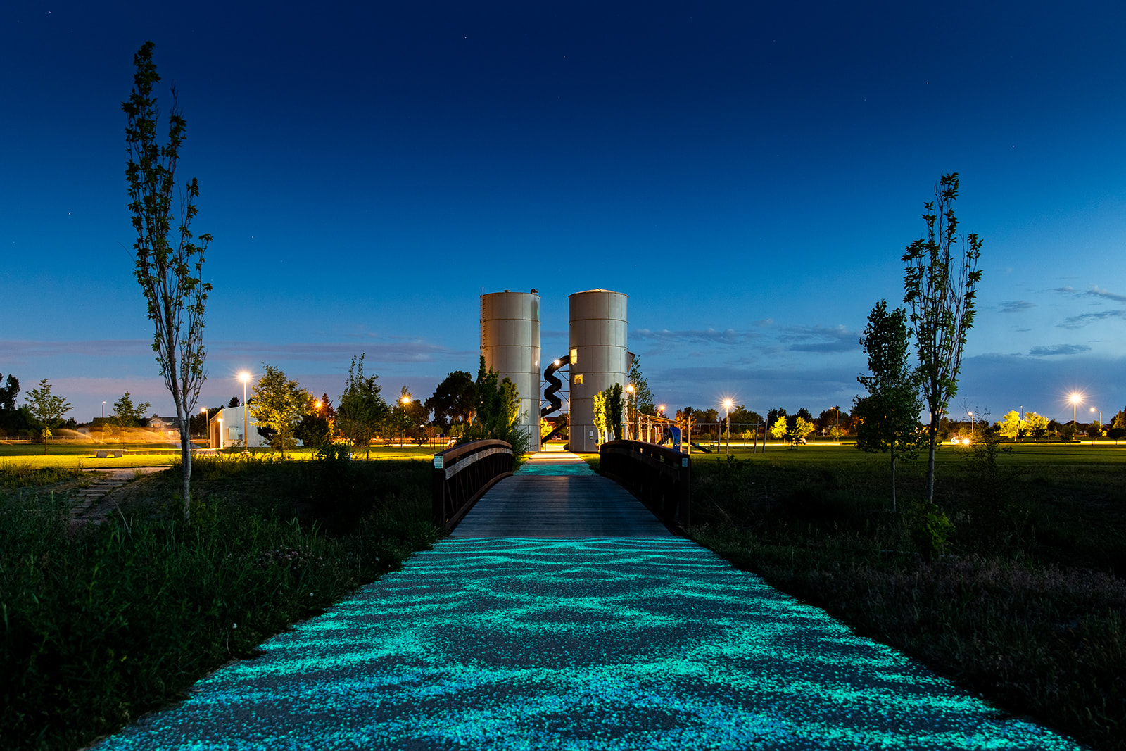 Glow stones lit up at night on a path at Twin Silo Park in Fort Collins, Colorado - John Robson Photography