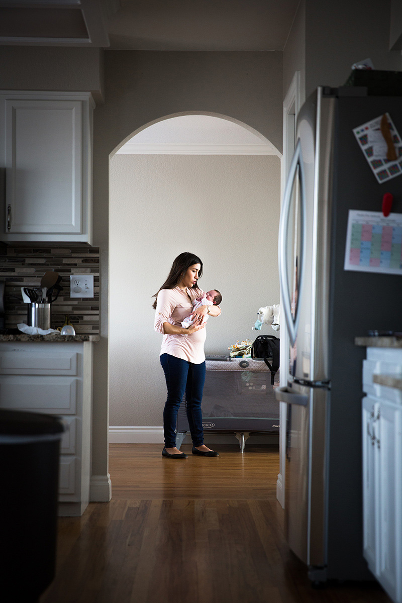 Maternity portrait of a caring woman holding her child - John Robson Photography
