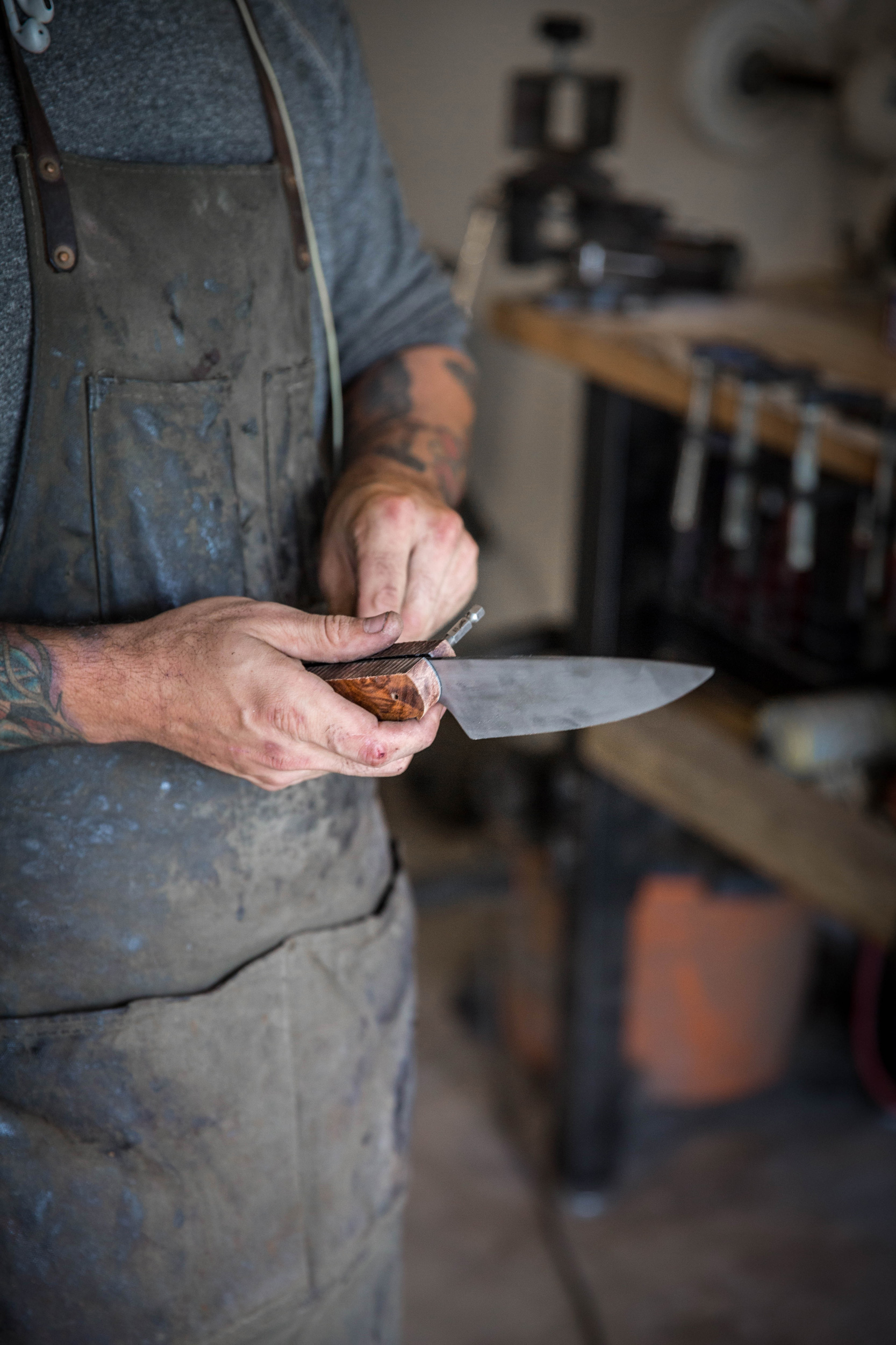 Knife maker working on a custom knife in Austin Texas - John Robson Photography