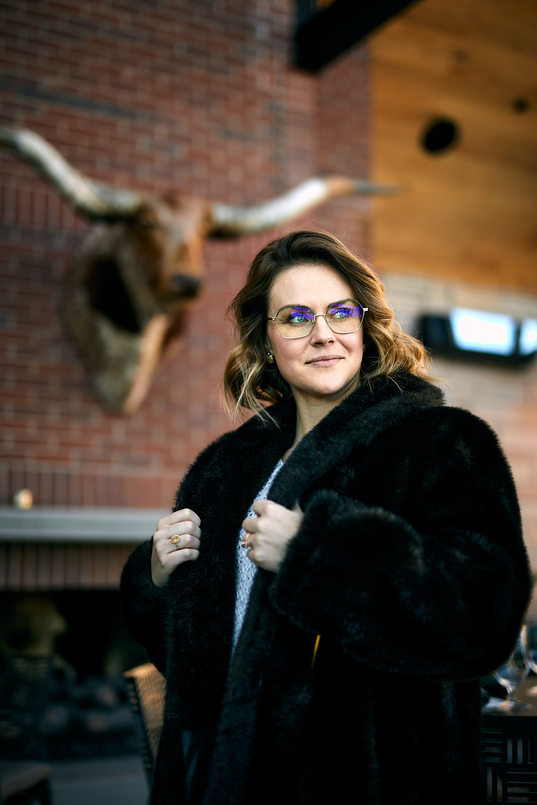 Portrait of a young woman wearing a faux fur coat at Ginger and Baker in Fort Collins, Colorado - John Robson Photography