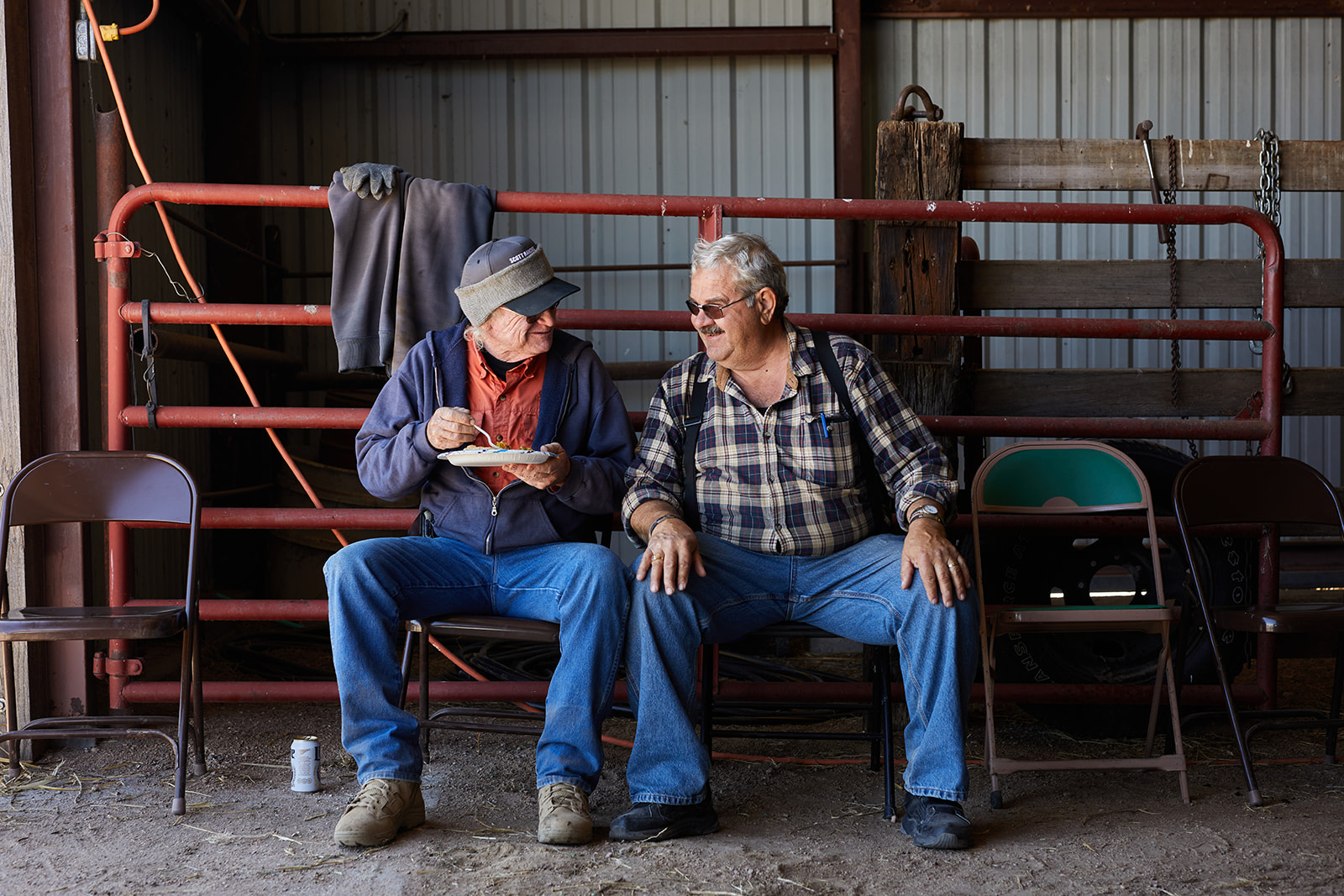 Ranchers enjoying lunch after branding cattle - John Robson Photography