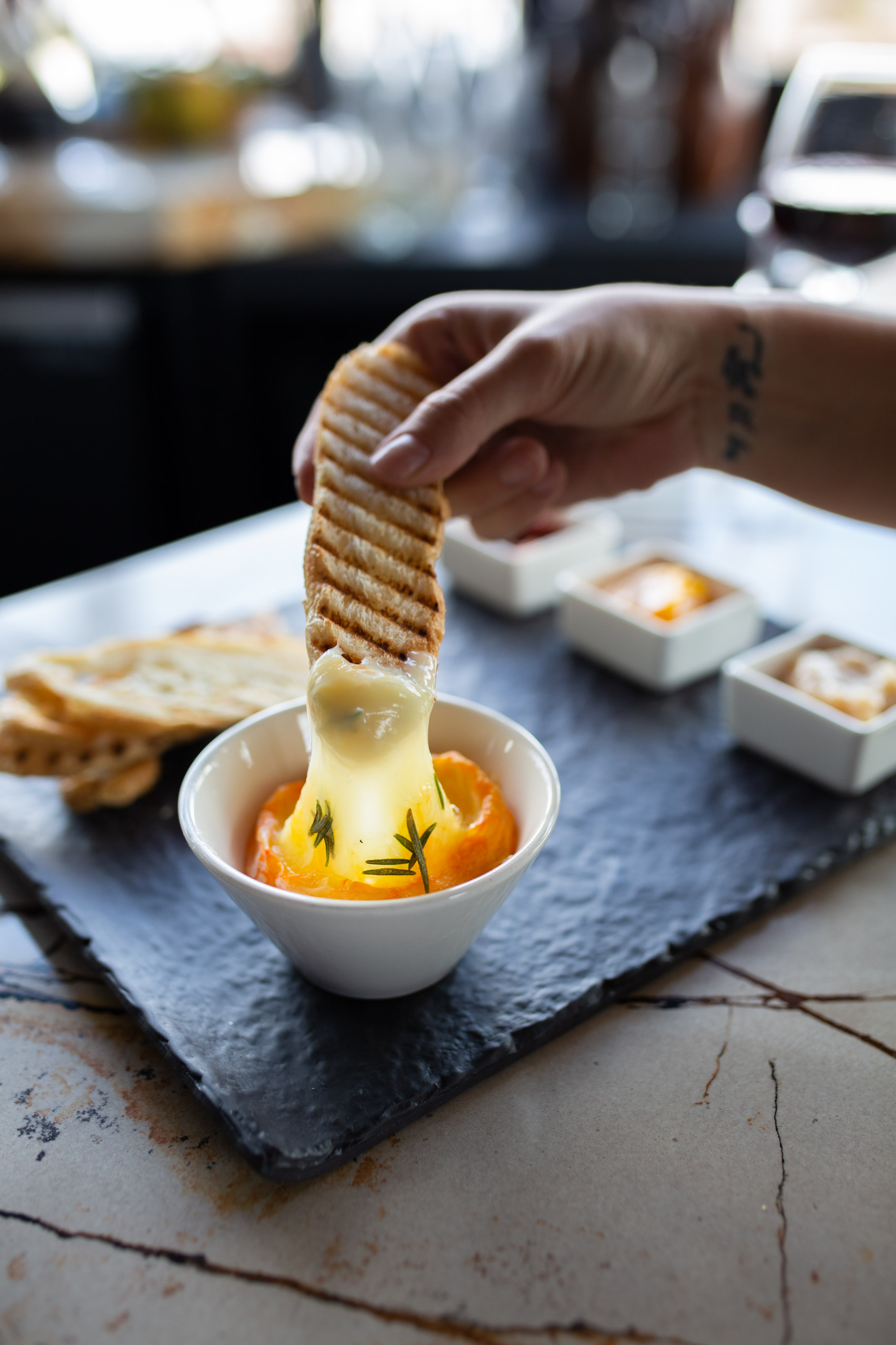 Editorial Photo for Fort Collins Lifestyle Magazine of crusty bread and cheese appetizer at Ginger and Baker restaurant - John Robson Photography