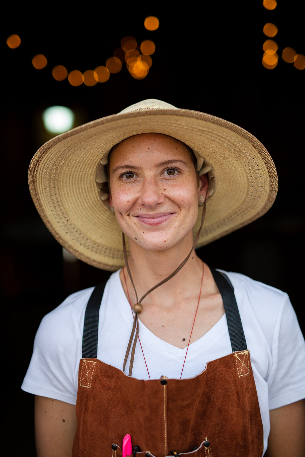 Portrait of a female chef in front of a open door - John Robson Photography