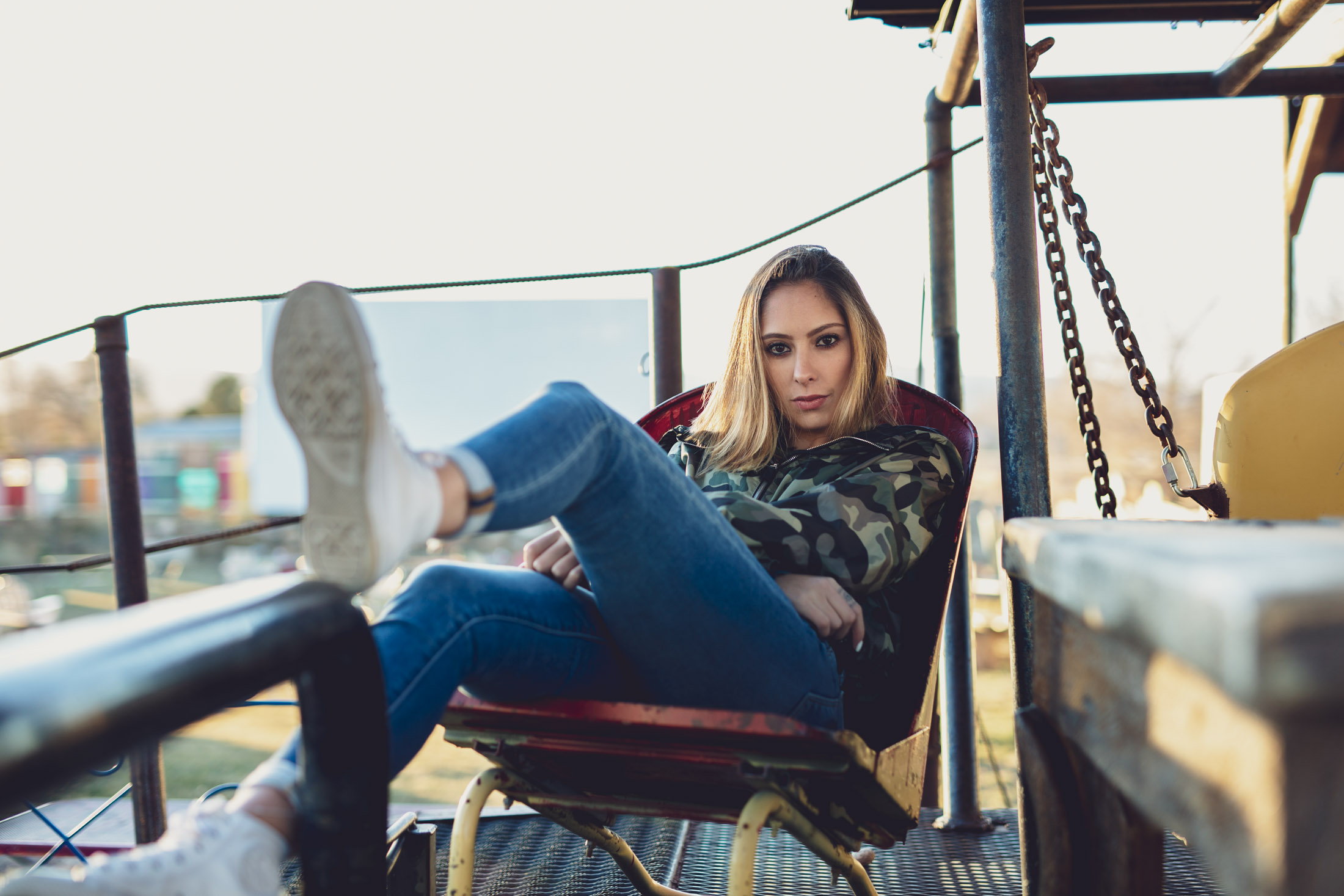 Portrait of a woman lounging at an eclectic outdoor theater in Fort Collins, Colorado - John Robson Photography