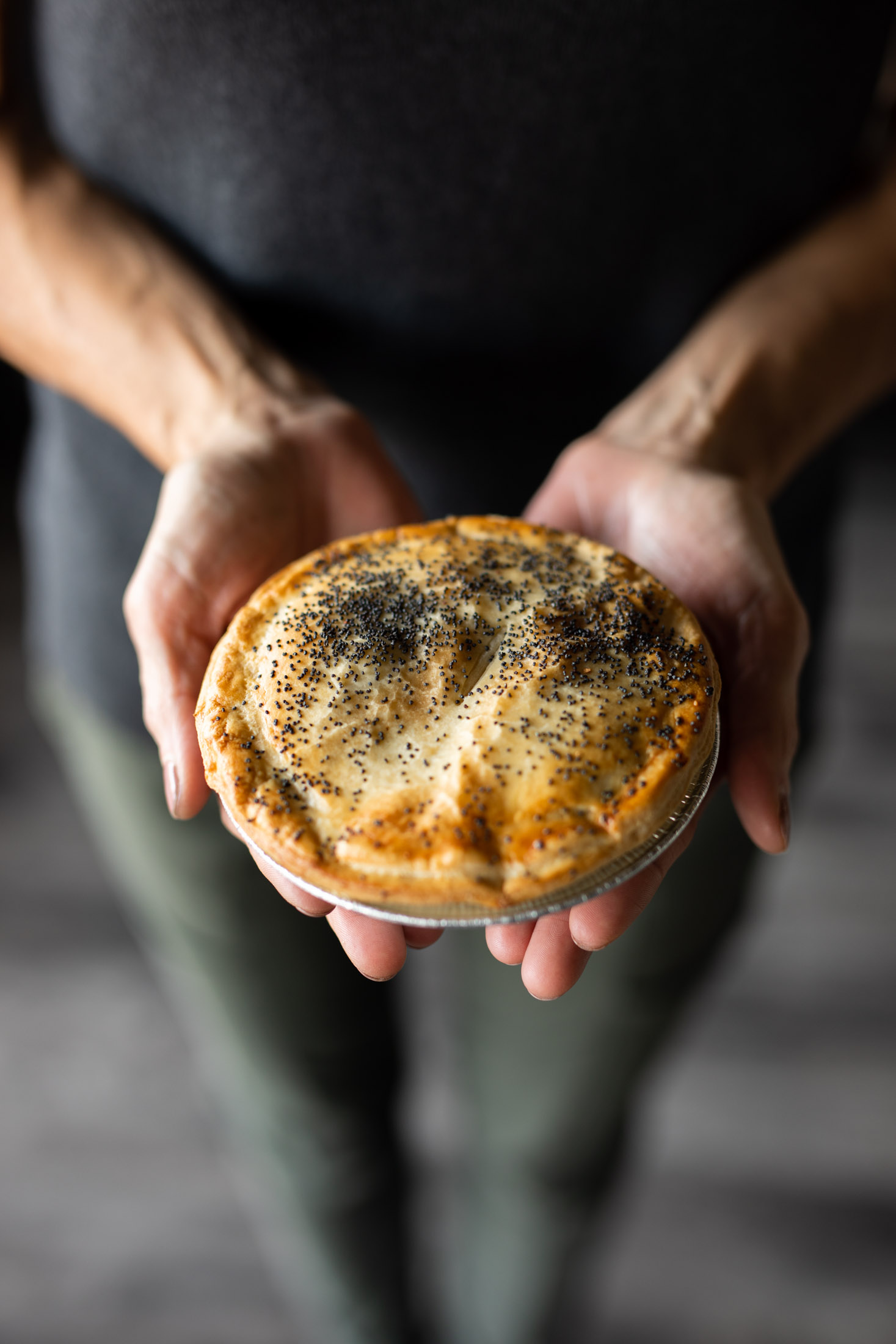 Waltzing Kangaroo meat pie being held - John Robson Photography