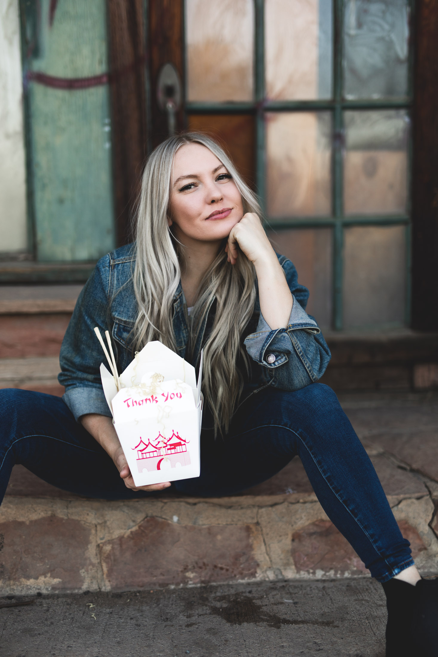 Portrait of a woman holding a Chinese food container - John Robson Photography